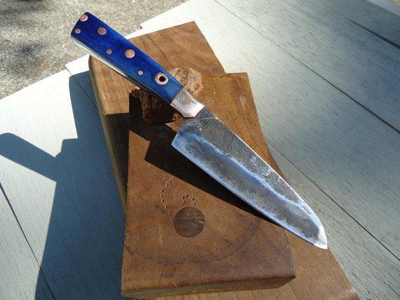 Hand-forged Japanese steel chef knife with blue bone handle custom made by Laevi Susman Metals Artisan