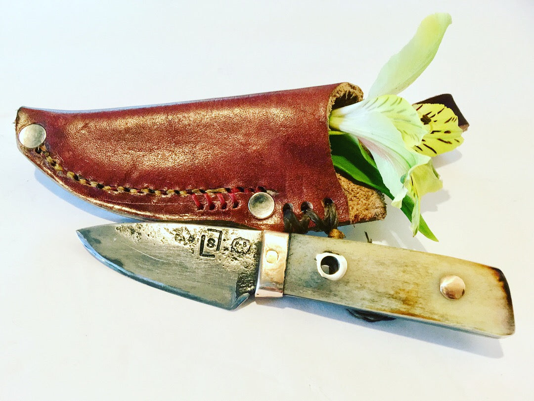 Belt knife with leather handle